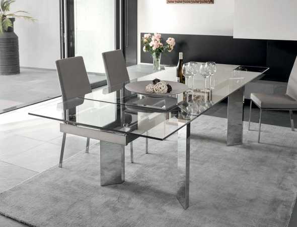 שולחן נפתח בעל בסיס מתכת ומשטח עליון מזכוכית.
ניתן להזמין במגוון מידות וחומרים.