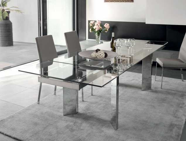 שולחן נפתח בעל בסיס מתכת ומשטח עליון מזכוכית.
ניתן להזמין במגוון מידות וחומרים.