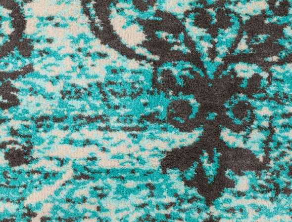 שטיח בגוונים אפור, טורקיז ובז' העשוי ממיקרו פייבר שטיח נעים וקל לתחזוקה. 